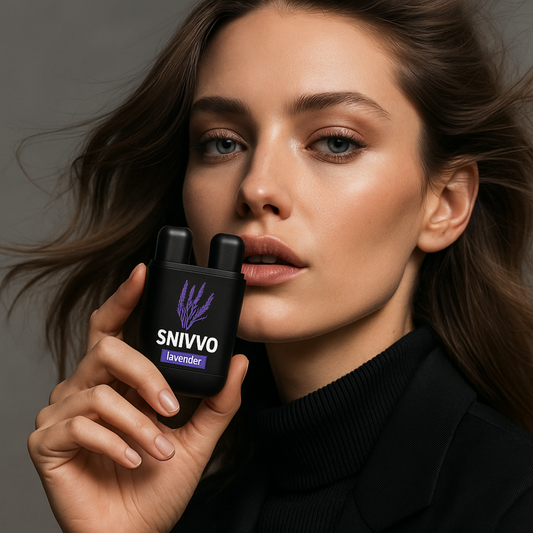 Woman holding a black inhaler labeled 'SNIVVO' with lavender design against a gray background
